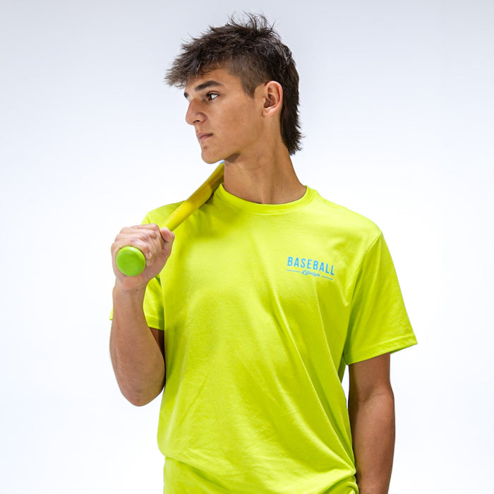 Person wearing a bright yellow t-shirt with 'BASEBALL Lifestyle 101' text, holding a green bat against a white background