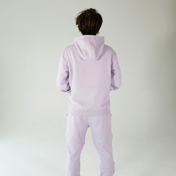 Adult model wearing Purple Baseline hoodie