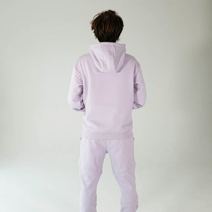 Adult model wearing Purple Baseline hoodie