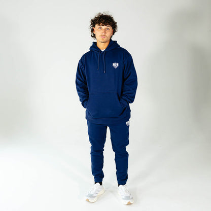 Adult model wearing Navy Baseline hoodie
