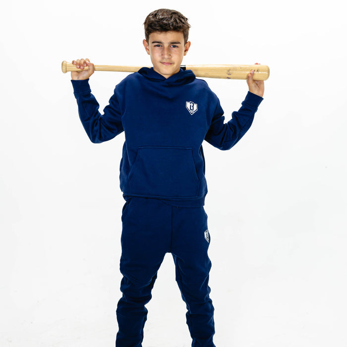 Youth model wearing navy Baseline youth hoodie