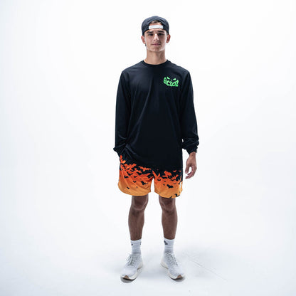 Adult model wearing orange shorts with "Bat Gradient" design