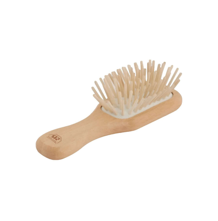 Compact hair brush with beechwood handle and wood pins.