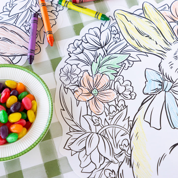 Die-cut Coloring Bunny Wreath Placemats with crayons and jelly beans on the Moss Painted Check Runner.