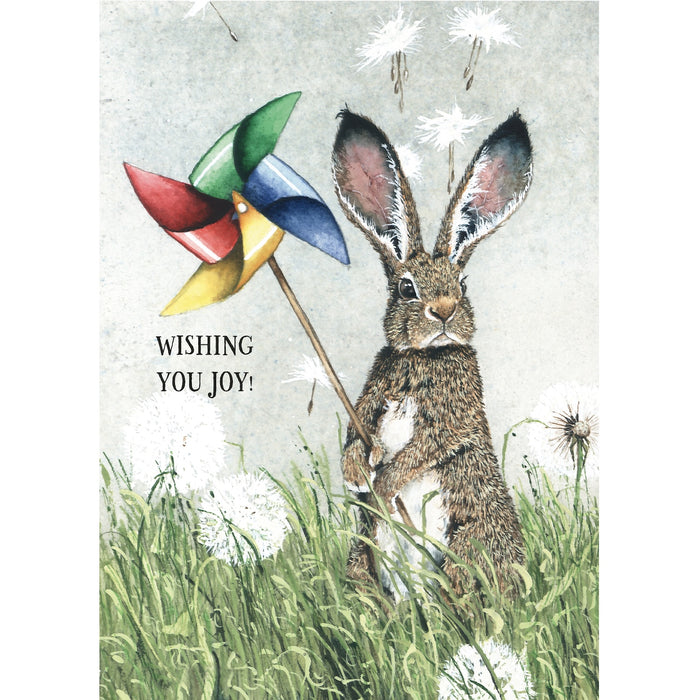 Illustration of a rabbit holding a colorful pinwheel with text 'Wishing You Joy!' in a grassy setting.