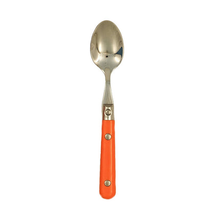 Spoon with an orange handle on a white background.