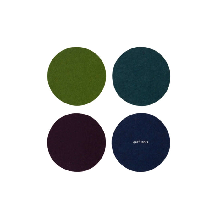 Four wool felt coasters in green, blue, purple, and navy with 'graf lantz' branding.