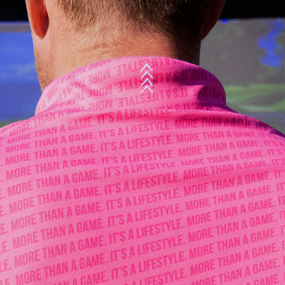 Adult model wearing pink and white More Than a Game Gradient polo