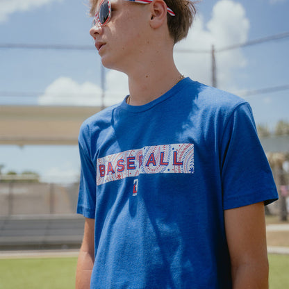 Youth model wearing blue Paisley Liberty youth graphic tee