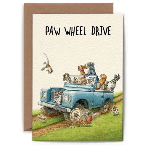 A whimsical illustration of dogs riding in a truck on a dirt road and text that reads "PAW WHEEL DRIVE".