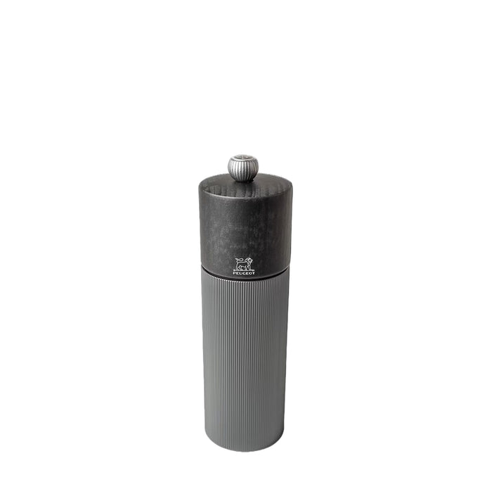 Gray pepper grinder with grey wooden top and metal body with Peugeot logo