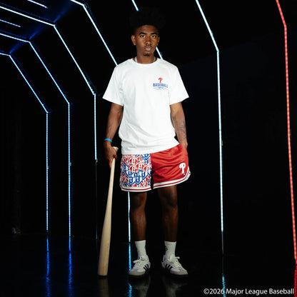 Adult model wearing red shorts with "Philadelphia Phillies Sticker Court" design