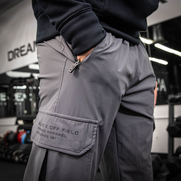 Adult model wearing gray Pro Series Long Cuff Cargo Performance joggers