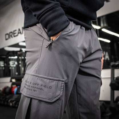 Adult model wearing gray Pro Series Long Cuff Cargo Performance joggers
