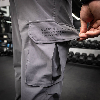 Youth model wearing gray Pro Series Long Cuff Cargo Performance youth joggers