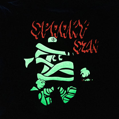 Youth model wearing blue youth graphic tee with "Spooky SZN Waffle" design